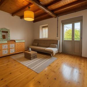 a living room with a couch and a table at Casa Milu in Armiello