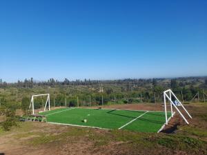 an empty soccer field with a soccer ball on it at Refugio Lo Más visto in San Antonio