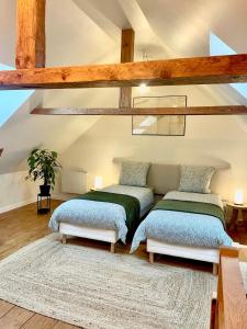 Postel nebo postele na pokoji v ubytování Le Pré de la Mer Le Gîte