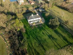 an aerial view of a large house in a field at Hawthorn Farmhouse in Winkton