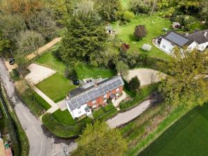 an aerial view of a house with a solar roof at Foxglove Cottage in Bransgore
