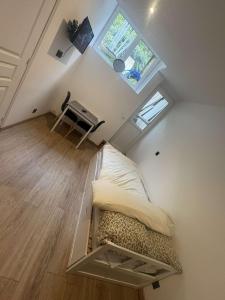 Postel nebo postele na pokoji v ubytování l 'escapade amiénoise 2