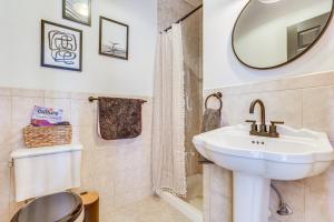 a bathroom with a sink and a mirror at Secluded Kerhonkson Retreat with Deck and Views! in Sundown +32 photos