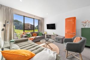 a living room with a couch and chairs and a tv at 1BR Apartment 43 sleeps 5,Golf,Beach,Hot Springs in Fingal