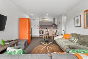 a living room with a couch and a table at 1BR Apartment 43 sleeps 5,Golf,Beach,Hot Springs in Fingal