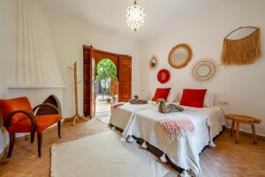 a bedroom with two beds and a fireplace at Riad du Bab atlas in Marrakesh +57 photos