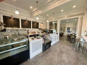 a large kitchen with a counter and a restaurant at The Brandon Inn in Brandon +52 photos