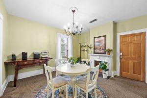 a dining room with a table and chairs at Spacious Historic House Near Louisville Sites in Louisville