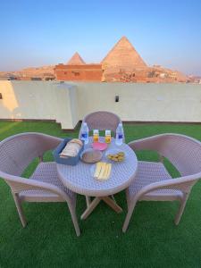 a table with a tray of food sitting on top at Retaj Pyramids View in Cairo