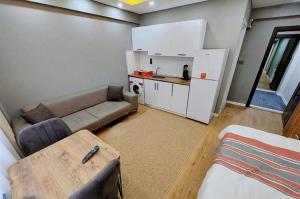 a small living room with a couch and a table at Sleepy Taksim Hotel in Istanbul +9 photos