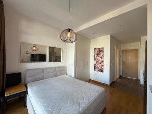 a bedroom with a large white bed in a room at BW Parkview Studio in Belgrade