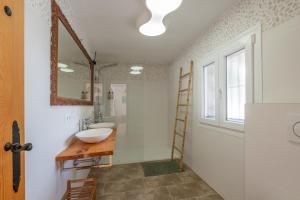 a bathroom with a sink and a mirror at Casa Cobalto, Sea view, Mediterranean, Sea 700meters, 4 Bedrooms in Benissa +41 photos