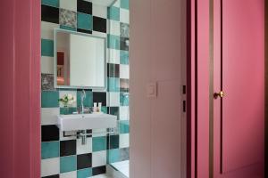 a bathroom with a sink and a mirror at Les Tournelles in Paris +53 photos