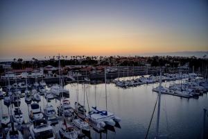 a group of boats docked in a marina at sunset at Ocean Blue in Oxnard