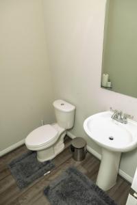 a bathroom with a white toilet and a sink at Cozy Room with Private bath in Richmond, TX in Richmond +21 photos