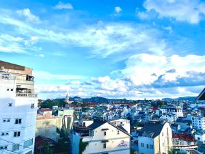 a view of a city under a cloudy sky at VALENTINEdalat Hotel in Da Lat