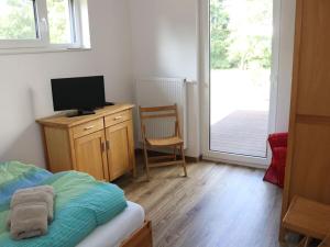 Μια τηλεόραση ή/και κέντρο ψυχαγωγίας στο Holiday apartment with 2 bedrooms +11 φωτογραφίες