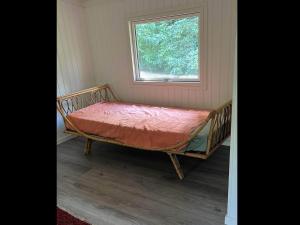 Un pat sau paturi într-o cameră la 4 star holiday home in Hornbæk