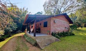 a small brick house with a ramp leading up to it at Sítio Canto do Monte in Rolante