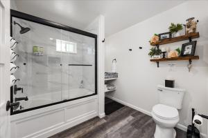 a bathroom with a shower and a toilet at The Petite-Villas at Dorner Family Vineyard in Tehachapi +49 photos