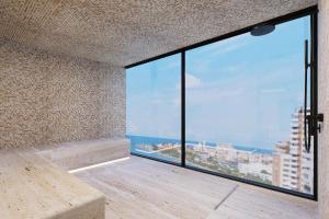 a room with a large window with a view of the ocean at Faranda Collection Cartagena, a member of Radisson Individuals in Cartagena de Indias