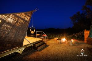 a hut with a fire and a net at night at Old Pound Smithy in Bideford