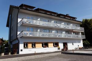 a building with balconies on the side of it at Hotel Garni Noval in Feldkirch