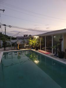 a swimming pool in front of a house at LakeOkechobeFishingfrm22DaylyfourprsMinPartyPerRoom in Pahokee