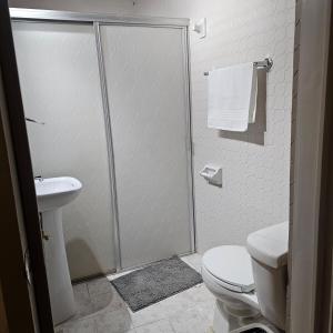 a bathroom with a shower and a toilet and a sink at Casa Centurias céntrico con mini Split in Aguascalientes +24 photos