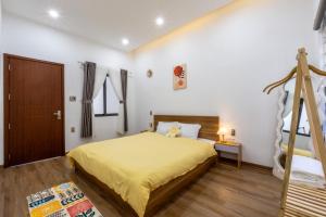 Postel nebo postele na pokoji v ubytování Nắng Homestay Đà Nẵng
