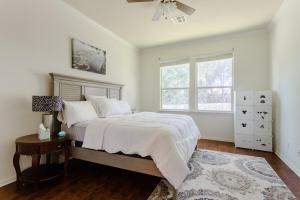 a bedroom with a large bed and a window at Round Rock Family Retreat 4BR 3BA Close to Shopping and Attractions Sleeps 10 in Round Rock +53 photos
