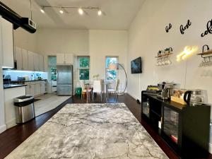 a kitchen and living room with a table and chairs at BP STAYS - Hotel-Style, No Host, Professionally Managed ID302 in Jersey City