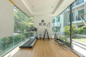 a gym with a treadmill and ellipticals in a building at C237 Brand New 1BR Condo Pool Gym Near Beach in Ban Thalat Choeng Thale