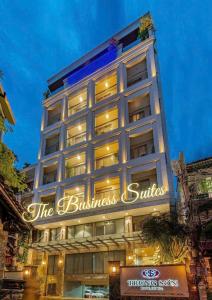 a building with a sign that reads the business suites at DHTS Business Hotel & Apartment in Ho Chi Minh City