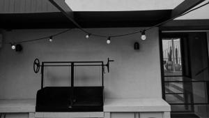 an empty altar with a cross and lights in a room at Escape to Summer, Bilgola Plateau IH Luxe in Bilgola