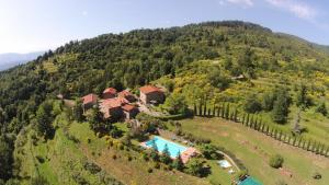 an aerial view of a house on a mountain at Borgo La Capraia in Castelfranco di Sopra