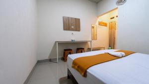 Кровать или кровати в номере Grand Soe Hotel +9 фотографий