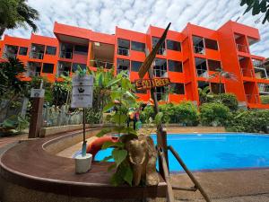 an elephant statue in front of a building with a pool at LAY TONG BEACH HOTEL Patong in Patong Beach +13 photos