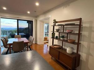 a living room with a table and a dining room at Havenwood Chalet 2 Bedrooms in Ravensbourne