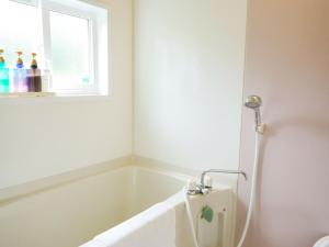a bath tub in a bathroom with a window at Le GRAND BLEU - Vacation STAY 31506v in Akaoki +66 photos