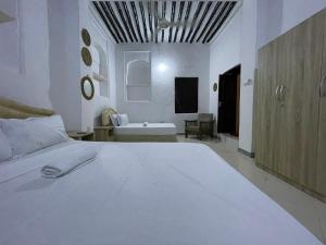 Ένα ή περισσότερα κρεβάτια σε δωμάτιο στο Vuga House