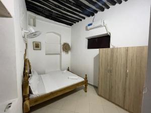 Ένα ή περισσότερα κρεβάτια σε δωμάτιο στο Vuga House +6 φωτογραφίες