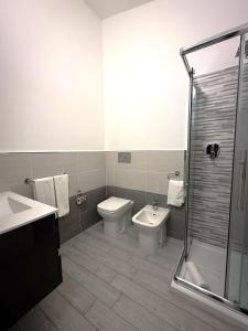 a bathroom with a toilet and a sink and a shower at Bentus B&B in Villasimius +30 photos