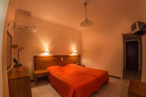 Postel nebo postele na pokoji v ubytování Chryssi Akti Hotel