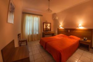 Postel nebo postele na pokoji v ubytování Chryssi Akti Hotel
