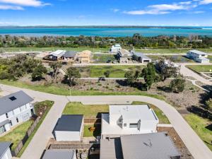 an aerial view of a house with the ocean in the background at Wirilda Seaside Escape in Inverloch