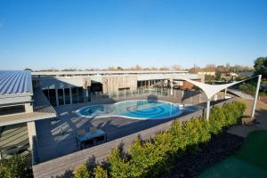an overhead view of a building with a swimming pool at Wirilda Seaside Escape in Inverloch