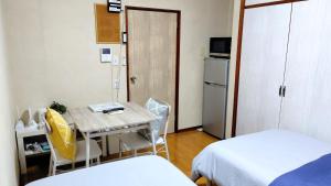 Postel nebo postele na pokoji v ubytování Kokusaigakusya Ozukikaikan - Vacation STAY 18798