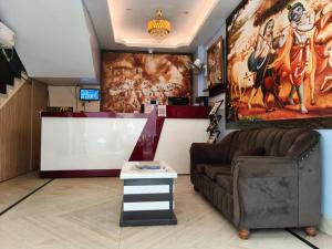 a living room with a couch and a table at Hotel Mahal in Uchalon +36 photos