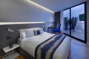 Postel nebo postele na pokoji v ubytování Ultra Tel Aviv Boutique Hotel